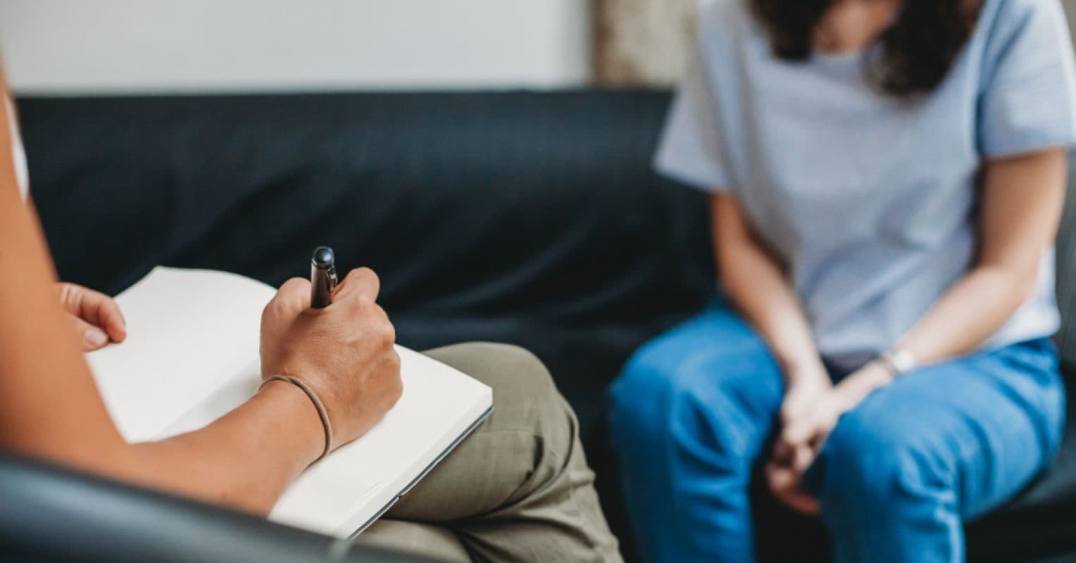 A healthcare professional in a compassionate patient interaction